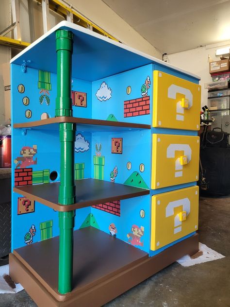 Custom Kids Dresser, Mario Furniture Diy, Mario Nightstand, Lego Mario Display Ideas, Super Mario Wall Art, Super Mario Room Ideas, Super Mario Themed Bedroom, Nintendo Game Room, Mario Dresser