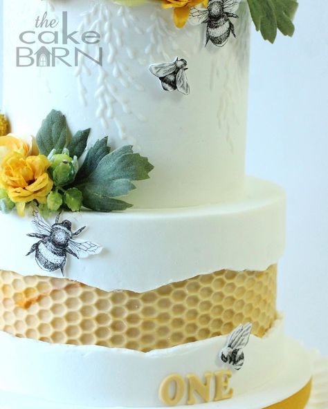 The Cake Barn on Instagram: “A little honey bee is turning one tomorrow! I do believe yellow is my new favorite color! I chose to do a honeycomb fault line design and…” Bee Wedding Cake, Bee Birthday Theme, Honeycomb Cake, Bee Cake, Two Layer Cakes, Bee Wedding, Bee Birthday Party, School Cake, Bee Cakes