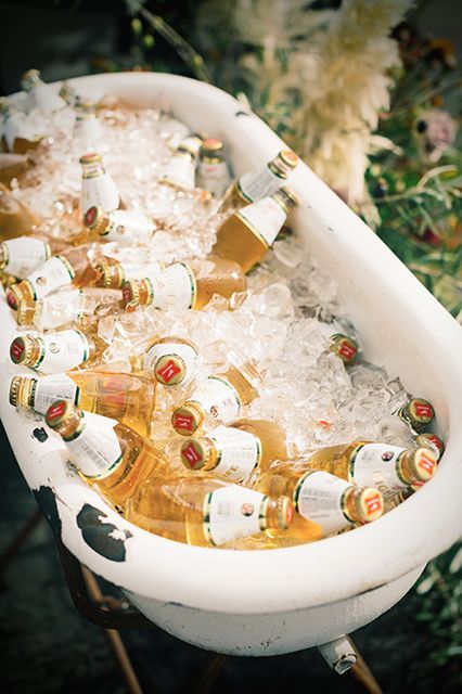 If you ask us, there are two kinds of weddings: ones that follow trends and ones that set them. So when we see a ceremony devoid of all the cliché Pinterest ideas — we get pretty (okay, very!) excited.  Enter San Francisco couple Jacy Ceccarelli and John Keddie, who really reinvented the wheel Bathtub Wedding Drinks, Beer Bucket Wedding, Beer Bath Wedding, Booze Bath Wedding, Wedding Drink Trough, Edgy Backyard Wedding, Vintage Bar Wedding, Bathtub Cooler, Wedding Cooler Ideas