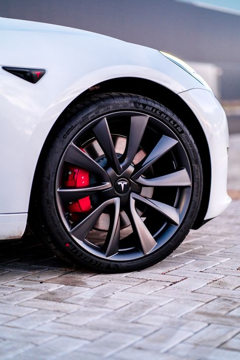 This is the Tesla model 3. Download this photo by Robin van Geenen on Unsplash Mercedes Benz Steering Wheel, Benz Steering Wheel, Silver Mercedes Benz, Silver Mercedes, Tesla Wheels, Tesla Car, Forged Wheels, Tesla Model 3, Car Exterior