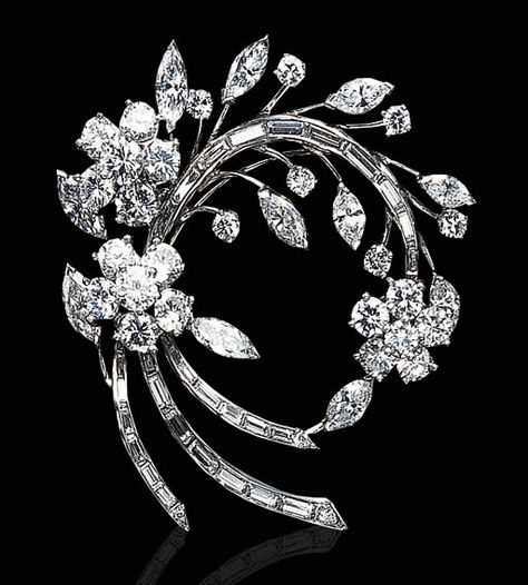 A DIAMOND AND PLATINUM BROOCH   Designed as a circular and baguette-cut diamond floral spray, accented by marquise-cut diamond leaves, mounted in platinum Bijoux Art Nouveau, Diamond Solitaire Earrings, Barbie Vintage, Diamond Brooch, Floral Spray, Vintage Jewels, Baguette Cut, Silver Gifts, Diamond Jewellery