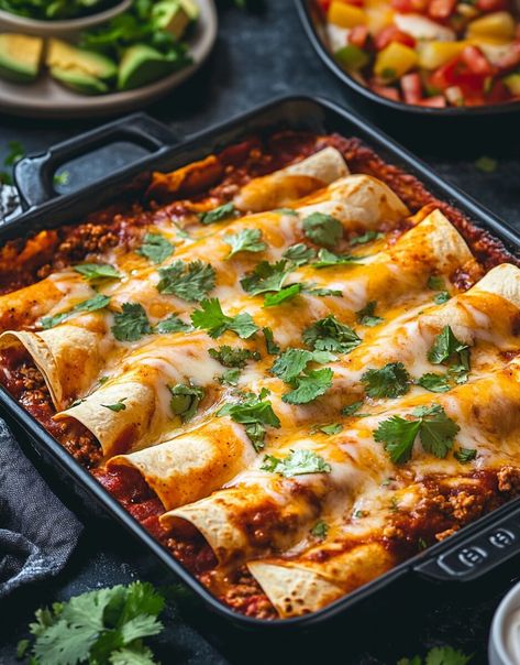 These Ground Beef Enchiladas are the ultimate comfort food. With tender tortillas wrapped around flavorful ground beef, all topped with a rich, tangy enchilada sauce and melted cheese, this dish ... Read more Ground Beef Tortilla Recipes, Ground Pork Enchiladas, Beef Enchiladas With White Sauce, Beef Enchiladas With Red Sauce, Ground Beef Enchilada Casserole, Polenta Pie, Best Beef Enchilada Recipe, White Sauce Enchiladas, Enchiladas Beef