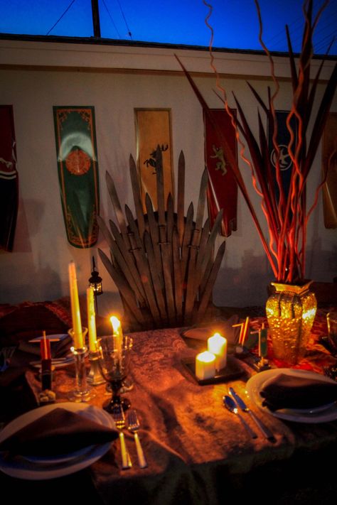 Epic Iron Throne in Kings Landing at night - beautiful Game of Thrones themed Dinner Party.  #gameofthrones #GOT #dinnerparty #themedparties #themedpartiesforadults #damngoodshindig #party #fun #westeros #ironthrone #kingslanding #decor Game Of Thrones Dinner, Game Of Thrones Decor, Game Of Thrones Birthday, Game Of Thrones Theme, Dinner Party Ideas, Game Of Thrones Party, Medieval Party, Bollywood Theme, Dinner Party Themes