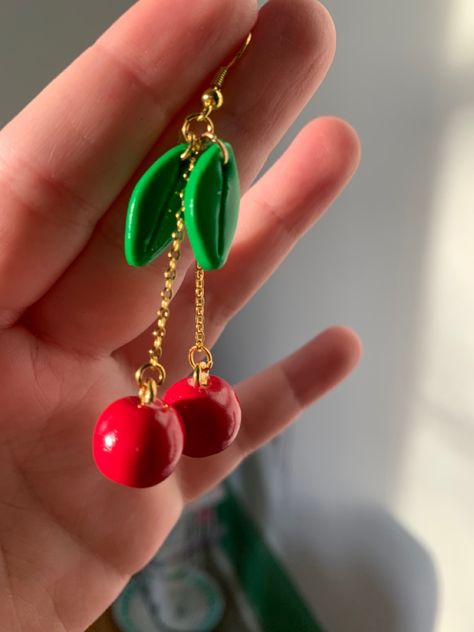 red clay balls on chains, connecting to oval shaped leaves to mimic cherries Cherry Polymer Clay, Polymer Clay Charm Earrings, Polymer Clay Cherry Earrings, Clay Cherry Earrings, Fruit Earrings Polymer Clay, 3d Polymer Clay Earrings, Diy Cherry Earrings, Fruit Polymer Clay, Cherry Polymer Clay Earrings