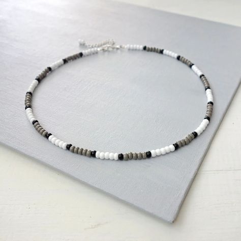 Unisex beaded choker necklace, mostly gray and white. #styleyourself #beadedchoker #unisexstyle #chokernecklace #seedbeads #beadednecklace #etsyseller #etsyshopowner #tlinejewelry Silver Beaded Choker With Spacer Beads, Adjustable Silver Beads Choker, Silver Adjustable Choker With Colorful Beads, White Beaded Metal Choker, Silver Faceted Beads Choker, Beaded Choker Necklace, Beaded Choker, Unisex Fashion, Grey And White