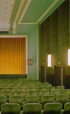 Vintage interior of a small theater decorated in shades of green and accented with gold.  #designinspo #interiorinspo #vintagemovietheaters #vintagetheaters #monochromemoment #monochromaticdesign #itsnoteasybeinggreen #greenandgold Photowall Ideas, Small Theatre, L Wallpaper, Vintage Interior, Green Rooms, Futurism, New Wall, Green Wall, Green Aesthetic