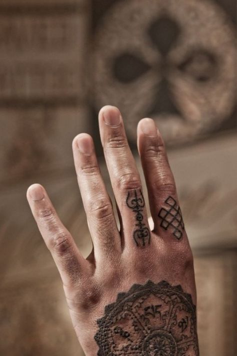 Hand Tattoo can be considered to be the most popular tattoos ever worn by thousands of individuals all over the world. Despite of the relatively small area, you will be surprised to see a variety of incredible tattoo designs on their hands. #smalltattoos #cutetattoos #tattooonhand #tattooonarm Henna Finger Tattoo, Mandala Arm Tattoo, Tibetan Tattoo, Thomas Hooper, Knot Tattoo, Finger Tattoo Designs, Shiva Tattoo Design, Shiva Tattoo, Incredible Tattoos