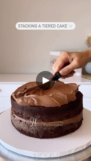 19K views · 1.1K reactions | Part 1: Making a 2 tiered cake 💫

Stacking + crumb coating + doweling the bottom tier. 

I don’t do many 2 tiered cakes and thank goodness 😅 although I do love how they look they are not my favourite to create. 

What are your thoughts on tiered cakes, worth the extra time they take or are single tiered just as beautiful? 😍 

Team single tier 🙋🏻‍♀️

Save and follow for more baking and decorating tips @lizfigolicakes 🤍

#reelsvideo #caketutorial #baking #bakingtips #bakingtutorial #cakedecorating #cakedecorator #cakeartist #cakeart #cake #cakes #caker #cakesofinstagram #cakesofillawarra #shellharbour #smallbusiness #cakereel #cakereels #reels #reelsinstagram #reelsvideo #reelsviral #reelslovers #reelstrending #engagementcake #tieredcake | LIZ FIGOLI CAKES Cake Stacking, 2 Tiered Cake, Baking Tutorial, Tiered Cake, Engagement Cakes, Cake Tutorial, Cake Decorating Techniques, Baking Tips, Do Love