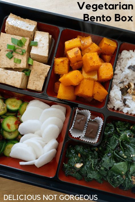 This bento box (with 4 different kinds of vegetables, tofu, rice and chocolate) is perfect for the person who likes to nibble around their plate at lunch. #bentobox #lunchideas #vegetarian Squash Sauteed, Kale And Rice, Vegetarian Bento, Tofu Sesame, Bento Box Lunch For Adults, Pickled Daikon, Bento Box Recipes, Vegan Lunch Box, Japanese Food Bento