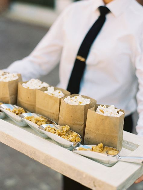 Bags of kettle corn (both salted and caramel!) work just as well as a pre-ceremony snack as they do as cocktail hour cuisine.  Cocktail hour or wedding favor? Cocktail Hour, Popcorn, Food Ideas, Tray, Snacks