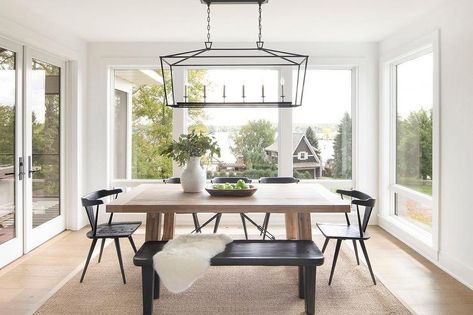 Darlena Linear Lantern boasts in a dining room above a light brow chunky wood dining table and a set of black wishbone chairs. Dinign Room, Beach House Room, Bria Hammel, Beach Home Interiors, Neutral Dining Room, Black Bench, Black Chairs, Beach House Interior, Beach House Design