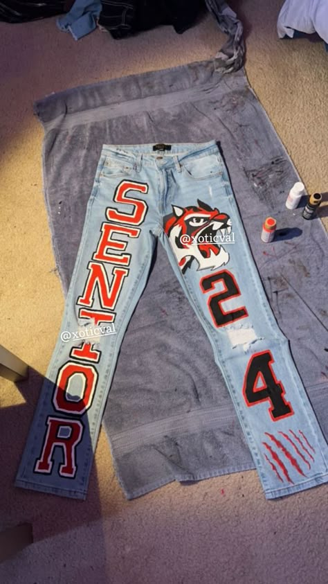 Senior Jeans Orange And Black, Diy Senior Pants, Senior Night Cheer Outfits, Custom Senior Jeans, Custom Senior Pants, Senior Pants Ideas Black People, Diy Senior Jeans, Cute Senior Jeans, Senior Jeans 2024