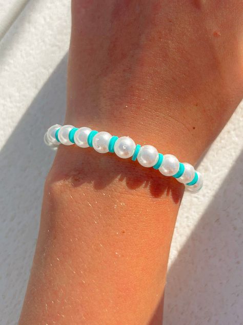 DIY Easy Bracelet Patterns: Perfect for Beginners Teal Bracelet Ideas, Round Beads Bracelet, Teal Clay Bead Bracelet, Pearl And Clay Bead Bracelet, Braslite Ideas, Cute Pearl Bracelet Ideas, Preppy Clay Bead Bracelets Ideas Aesthetic, Pearl Bead Bracelet Ideas, Clay Bead Bracelet Ideas With Pearls