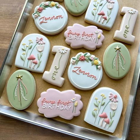 Emily Perkins (@thecookiedesigner) • Instagram photos and videos Fairy First Birthday Party Cookies, Garden Fairy Cookies, Fairy Birthday Cookies Decorated, Fairy 1st Birthday Cookies, Wildflower 1st Birthday Cookies, Fairy Decorated Cookies, Fairy Fifth Birthday Party, Fairy Party Cookies, Floral First Birthday Cookies