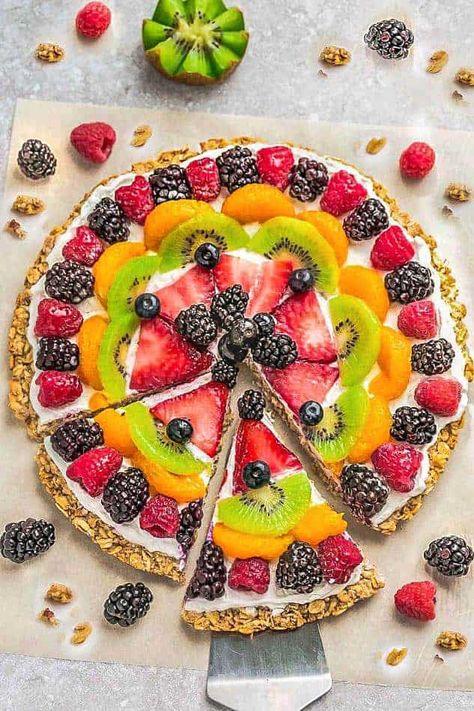 This Healthy Fruit Pizza recipe makes the perfect easy breakfast, brunch or dessert. Made with gluten free granola crust, fresh fruits and Greek yogurt. Healthy Fruit Pizza Recipe, Breakfast Fruit Pizza, Coconut Whipped Cream Recipe, Fruit Pizza Bar, Dessert Pizza Fruit, Fruit Pizza Crust, Fruit Pizza Sugar Cookie Recipe, Healthy Fruit Pizza, Pizza Healthy