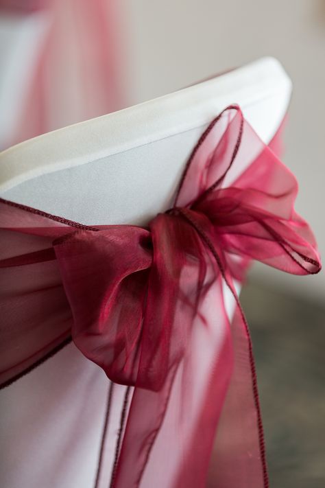 Lovely burgundy chair sash Burgundy Chair Sashes, Burgundy Chair Covers Wedding, Burgundy Wedding Chair Decor, Chair Sash Ideas, White And Gold Wedding Themes, Entertaining Christmas, Sash Ideas, Wedding Chair Sashes, Masquerade Theme