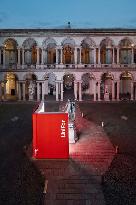 unifor exhibits a giant red book during milan design week Book Installation Art, Red Installation, Book Exhibition, Urban Art Installation, Ron Gilad, Book Installation, Book Expo, Book Event, Outdoor Installation