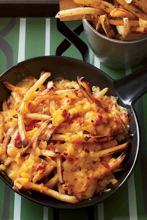 These over-the-top French fries are broiled with a tequila-spiked pimento cheese topping. It's wonderfully decadent melted into the fries and also an excellent dip. #appetizers#appetizerrecipes#appetizerideas#apps#entertaining#sidedishrecipes#sides#dinnersidedish#sidedishes#sidedishideas French Fries Recipes, French Fries With Cheese, Dip Appetizers, Chickpea Fries, Fries Recipes, Canadian Dishes, Oven Baked Fries, Pimiento Cheese, Crispy French Fries