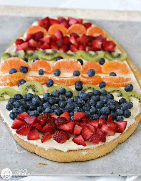 Sugar Cookie Easter Egg Fruit Pizza | Easy to make Easter treat. Cream Cheese frosting topped with your favorite fruits | Colorful Spring Dessert Ideas | TodaysCreativeLife.com Egg Fruit Pizza, Fruit Easter, Easter Egg Fruit Pizza, Sugar Cookie Fruit Pizza, Cookie Fruit Pizza, Homemade Sugar Cookie Dough, Sugar Cookie Pizza, Egg Fruit, Fruit Sugar Cookies