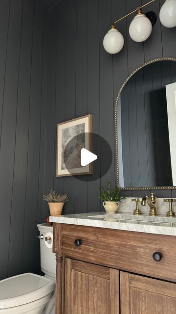 Leah White | Home Design & Decor on Instagram: "There is nothing like a moody powder bath to me! 😍 It transcends trends, in my humble opinion. Plus, if you love it, who cares if it’s in or out! I love vertical shiplap and knew I wanted to incorporate it into our powder bath, using a moody paint color with just the right amount of depth 😍 I love it combined with the warm wood vanity, marble countertop and mixed metals. I am still searching for the perfect artwork for all of my spaces including this one, but all in good time! Loving the way this moody but simple space looks for now. 🫶🏻 SAVE this post for powder bath details and follow along as we make our house a home 🤍 Powder Bath details ✨ Walls -6 inch vertical Shiplap Paint - Sherwin Williams Peppercorn Vanity, plumbing, and towel r Navy Shiplap Bathroom, Painted Shiplap Bathroom, Bathroom Vertical Shiplap, Shiplap Half Bathroom, Powder Room Board And Batten, Shiplap In Bathroom, Vertical Shiplap Half Wall, Vertical Shiplap Bathroom, Moody Powder Bath