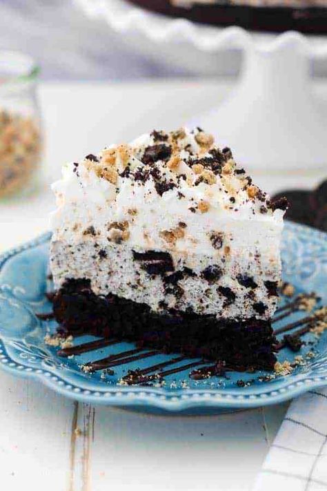 This Oreo Brookie Mousse Cake is a delicious recipe that combines all your favorite desserts! It has a fudgy brownie bottom, a layer of Oreo cheesecake, and chocolate chip cookie mousse! #oreomousecake #mousecake #oreodessert #oreocheesecake Oreo Mousse Cake, Oreo Brookie, Cookie Mousse, Oreo Mousse, Beyond Frosting, Oreo Desserts, Cookie Brownie, Mousse Cake Recipe, Fudgy Brownie