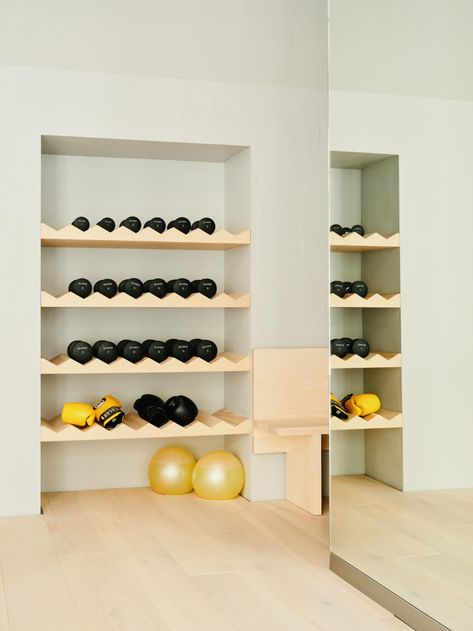 workout equipment in Hagius Berlin gym Home Gym Built In Storage, Hidden Gym Equipment, Hidden Home Gym, Boutique Gym Design Fitness Studio, Half Garage Gym Ideas, Half Garage Gym, Garage Gym Design, Dior Spa, Gym Equipment Storage