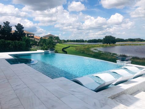 Custom infinity edge pool and spa. Infinity Edge Pool Backyards, Backyard Infinity Pool, Infinity Pool Ideas, Infinity Pool Sloped Yard, Infinity Edge Pool Design, Infinity Pools Backyard Ideas, Pool With Infinity Edge, Small Infinity Pool, Rectangular Infinity Pool