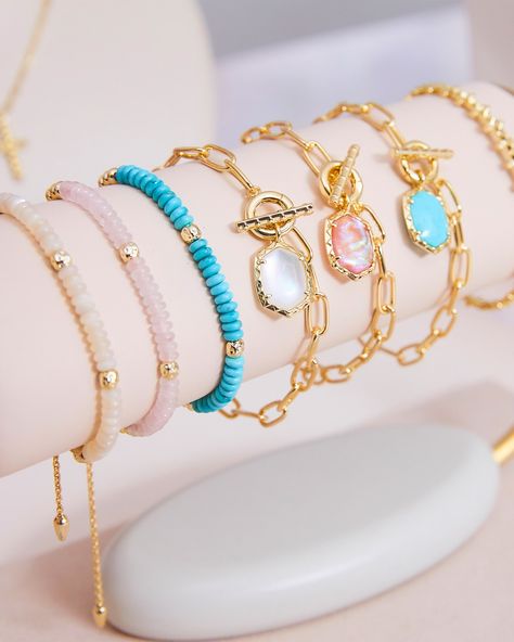 If you’re looking to shake up your bracelet stack, look no further than the Daphne Gold Link and Chain Bracelet in Variegated Turquoise Magnesite. With its paperclip chain, and detailed toggle closure, this bracelet does it all. Pair it with the Daphne Link and Chain Necklace for a chic, coordinated look. Metal 14k Yellow Gold Over Brass Material Variegated Turquoise Magnesite Closure Toggle Size 6.5"Inner CircumferenceDue to the one-of-a-kind nature of the medium, exact colors and patterns may vary slightly from the image shown. | Kendra Scott Daphne Gold Link and Chain Bracelet in Variegated Turquoise Magnesite | Variegated Magnesite Wrist Stack, Gold Bracelets Stacked, Kendra Scott Bracelet, Preppy Jewelry, Gold Link Chain, Gold Link, Gold Band Ring, Jewelry Lookbook, Delicate Chain