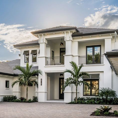 This gorgeous coastal-style residence was designed by Divco Custom Homes along with Design West, located in the luxurious Grey Oaks community of Naples, Florida. Coastal Homes Exteriors Florida, Modern Coastal Home Exterior, Minimalist House Exterior, Coastal Homes Exteriors, Florida Homes Exterior, Coastal House Exterior, West Indies Home, Coastal Home Exterior, Luxury Homes Exterior