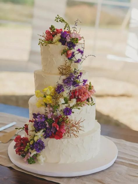 Four-tier white rustic wedding cake with cascading wildflowers Cakes With Flowers, Wildflower Cake, Fancy Wedding Cakes, Wildflower Wedding Theme, Spring Wedding Cake, Small Wedding Cakes, Buttercream Wedding Cake, Wedding Cake Rustic, Rustic Wedding Cake