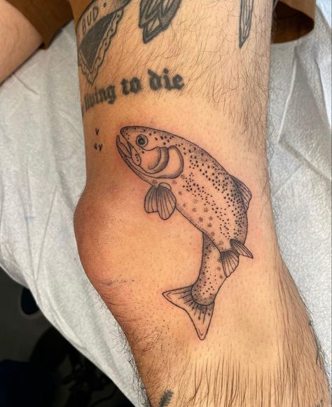 Fly Fishing Tattoo Ideas, Horizontal Tattoo Placement, Fish Knee Tattoo, Fish Tattoo Leg, Bass Fish Tattoo Women, Fish Around Knee Tattoo, Fish Tattoo Thigh, Trout Tattoo Women, Thigh Fish Tattoo