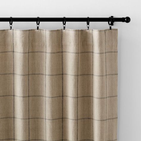 Our curtain panels frame windows with a decor-friendly pattern and the breezy look of natural linen. With a graceful drape, the warm beige curtains showcase windowpane checks composed of double-lined pinstripes in dark grey. A blackout lining blocks unwanted illumination and provides privacy, while putting the focus on the organic beauty of woven linen. Hang our exclusive linen curtains with blackout liners from the back tabs for a pleated look, or use the rod pockets to create a more casual, ga Patterned Bedroom Curtains, Kitchen Dining Curtains, Taupe Linen Curtains, Pattern Drapes For Living Room, Earthy Bedroom Curtain Ideas, Green Curtains Living Room Decor, Plaid Window Treatments, Family Room Drapery Ideas, Curtains Over Doors