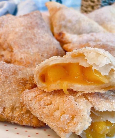 Fried Hand Pies are a classic southern treat! Fresh Peaches with a hint of cinnamon inside a super tender flaky homemade pie crust, fried, and sprinkled with cinnamon sugar. The BEST hand pie recipe you'll ever need! Peach Cobbler Hand Pies, Baked Peach Hand Pies With Fresh Peaches, Hand Fried Pies, Peach Turnovers Pie Crust, Homemade Hand Pies Crust Recipe, Lemon Fried Pies, Peach Turnovers With Fresh Peaches, Ideas For Fresh Peaches, Fried Peach Pies With Fresh Peaches