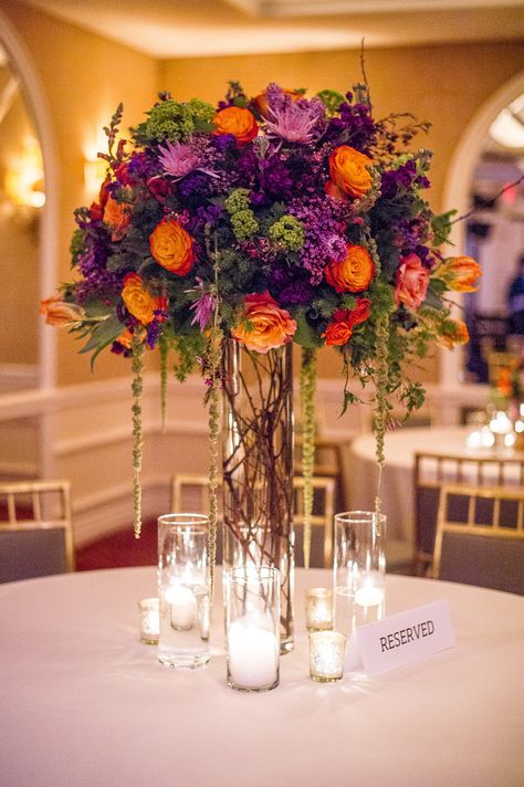 Purple and orange fall arrangement. Branching Out Floral & Event Design Photography: Amy Herfurth Photography - www.amyherfurth.com  Read More: http://www.stylemepretty.com/texas-weddings/2014/01/15/colorful-rosewood-turtlecreek-mansion-wedding/ Purple And Orange Wedding, Purple Wedding Centerpieces, Tall Wedding Centerpieces, Fall Wedding Centerpieces, Fall Arrangements, Wedding Table Flowers, Floral Event Design, Tall Vase, Fall Wedding Flowers