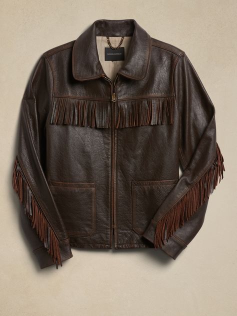 Based on a vintage piece from the Banana Republic archives, this luxurious, burnished leather jacket delivers emotional appeal with textured, fringed trim at the shoulders and sleeves, plus patch pockets for a true rancher-style silhouette.  WARMER: Understated Leather Brand, Cowgirl Leather Jacket, Collared Leather Jacket, Cool Leather Jackets, Fringe Clothes, Western Jacket Women, Cowboy Leather Jacket, Fur Lined Leather Jacket, Brown Fringe Jacket