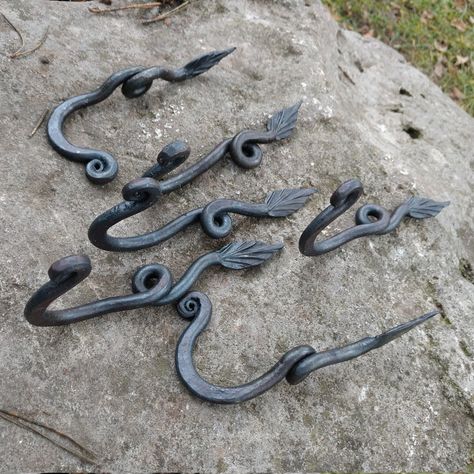 "Iron anniversary gift, 6th anniversary gift, set of six wall hangers, wall hooks, housewarming gift, forged products, key holder, wall decor Here's a wonderful set of six wall hooks made of forged steel, in the form of artistically twisted spirals and leaves .This set can serve as a birthday present, 6th anniversary of the wedding, or as a decor for the home. Wall hooks will serve for many years, because they are made of tempered iron. Hangers Dimensions: length-12cm (4.72 \") width-2cm (0.78 \ Black Hand Forged Jewelry For Gift, Forged Coat Rack, Small Forged Items, Forged Coat Hooks, Key Holder Wall, Blacksmithing Projects, Wrought Iron Hooks, Blacksmithing Ideas, Iron Anniversary Gifts