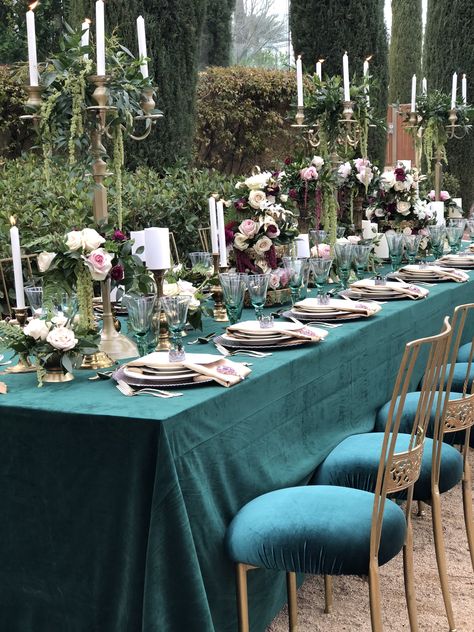 Elegant royal-themed tablescape with jewel tones and gold accents #tablescapes #jeweltones #candelabra #centerpieces #longtable #decor #chameleonchairs Royal Green Wedding Theme, Royal Theme Wedding, Teal Wedding Decorations, Jewel Tone Wedding Theme, Jewel Tone Wedding Colors, Candelabra Centerpieces, Emerald Green Wedding Theme, Green Wedding Decorations, Royal Theme