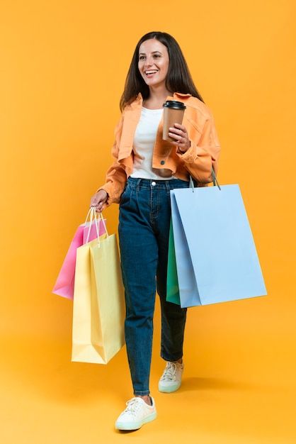 Free Photo | Front view of smiley woman posing with shopping bags and tags Holding Bag Pose Reference, Holding Cup Pose, Lots Of Shopping Bags, Holding Shopping Bags, Woman Posing, Heart Drawing, Female Poses, Reference Photos, Front View