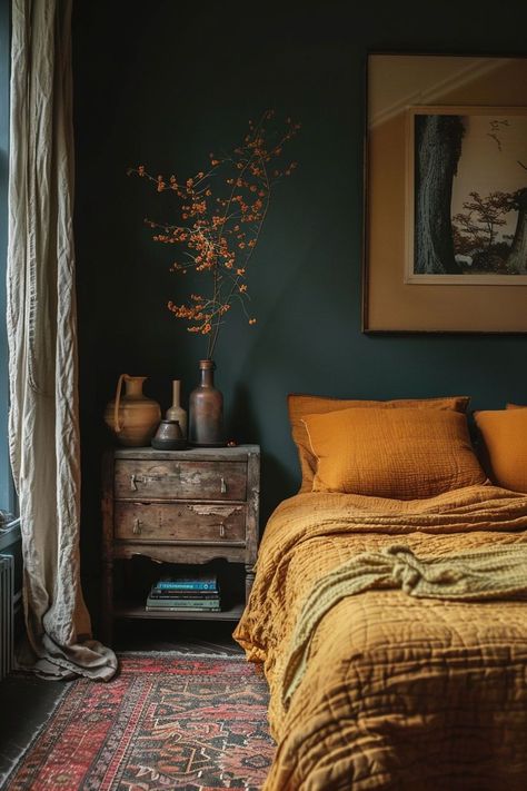 Incorporating earthy bedroom decor brings a sense of grounding and warmth, with its natural color palette and tactile elements contributing to a soothing and restful environment. The use of earthy materials like wood, stone, and natural fibers adds an organic, comforting touch to the bedroom, creating a serene and inviting space for relaxation. Dark Green Bedroom Aesthetic Ideas, Earth Tone Apartment Aesthetic, Terra Cotta And Teal Bedroom, Reclaimed Wood Furniture Bedroom, Best Colors For Dark Rooms, Teal And Terracotta Bedroom, Earth Tone Bedroom Colors, Dark Green And Terracotta Bedroom, Blue Earthy Bedroom