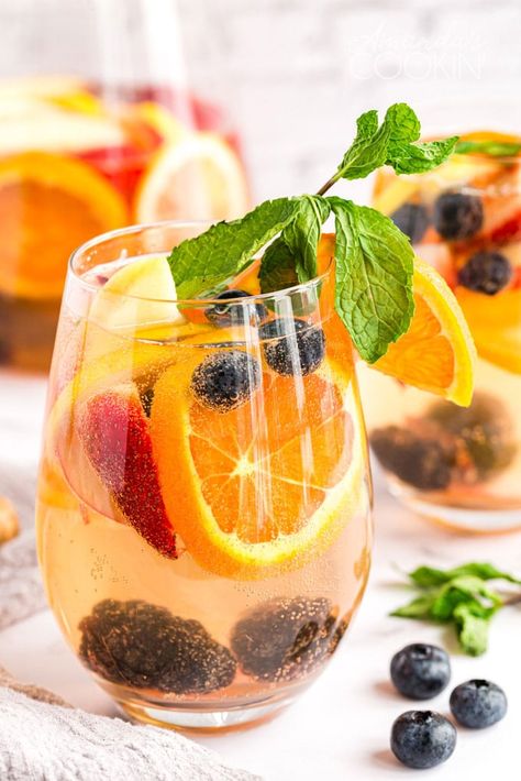 This White Sangria is a huge hit any time we make it for a BBQ, holiday gathering or social event. Kick back and enjoy a glass of white sangria this summer! White Sangria Recipe Fall, Thanksgiving Sangria Recipes White Wines, Thanksgiving Sangria Recipes, Sangria Recipes White, Riesling Sangria, Moscato Sangria Recipes, Thanksgiving Sangria, Best Sangria Recipe, Pineapple Sangria