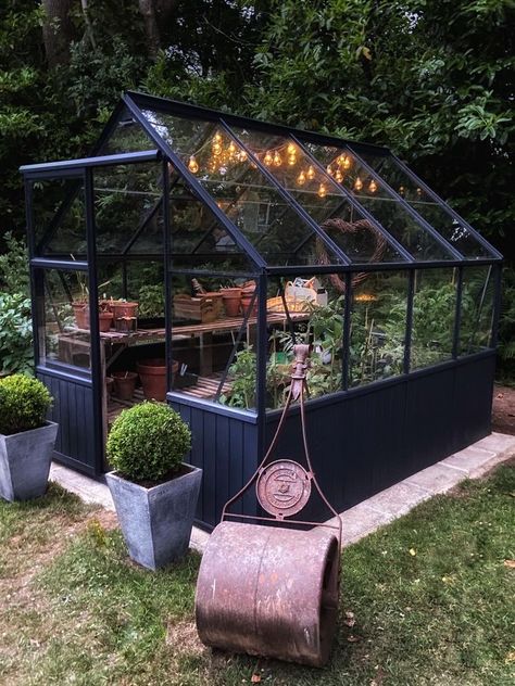 Home Garden Greenhouse, Small Black Greenhouse, Greenhouse In Garden Design, Small Greenhouse Vegetable Garden, Greenhouse Patio Porches, Glasshouse Garden Ideas, Yard With Greenhouse, Backyard Greenhouse Landscaping, Black Frame Greenhouse