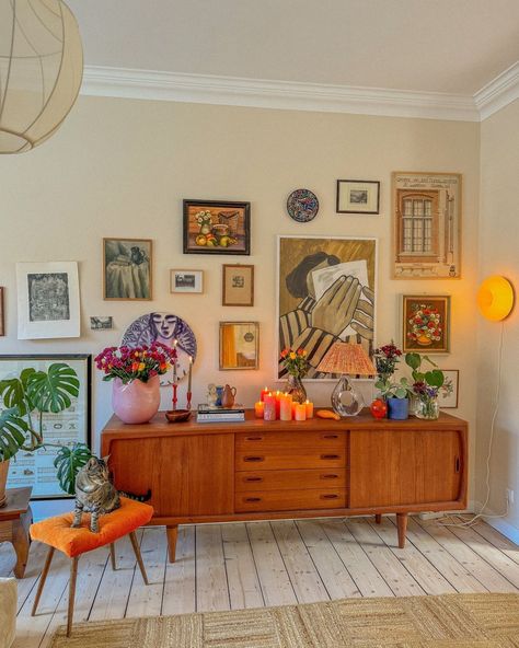 🌿✨ Loving this cozy, mid-century inspired space filled with character, textures, and art that tells a story. Every detail—from the curated wall art to the bold pops of color—is giving us major interior design goals! And how adorable is this curious little kitty posing perfectly? 🐾 Inspired by these beautiful spaces? Let us know which piece caught your eye, and don’t forget to hit that follow button for more home decor inspo! 💫 What would you add to this setup? Let’s chat in the comments!👇 ... Cute Entryway, Cute Dresser, Dresser Aesthetic, Beautiful Spaces, Follow Button, Dresser Decor, Entryway Furniture, Cozy Room, Console Tables