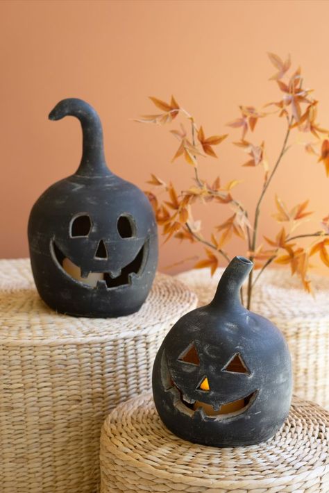 These 14.5"and 10" smiling jack-o-lanterns in black Honduras clay can be lit from within. Line your drive or perch them on your porch for a decorating treat. These fellows look extra striking arranged with orange and white pumpkins in spooky season. Set Of 2 Black Clay Jack-O-Lanterns H4433 Pottery Barn pumpkins dupe and DIY ideas and tricks. Urban outfitters Halloween decor ideas. Free people living Anthroliving Anthropologie home. Buyer Retailer Retail Wholesale To the Trade. Halloween Luminaries, Jack Lantern, Candle Luminaries, Lantern Candle Decor, Lantern Set, Black Clay, Taper Candle Holders, White Pumpkins, Halloween Home Decor