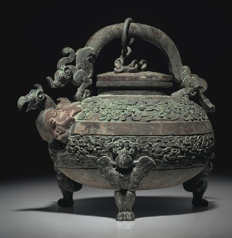 A RARE FINELY CAST TRIPOD EWER AND COVER, HE | WARRING STATES PERIOD (475-221 BC) | bronze, China | Christie's Chinese Sculpture, Zhou Dynasty, Warring States Period, Historical Objects, Chinese Bronze, Chinese Pottery, Native Design, Chinese Ceramics, China Art