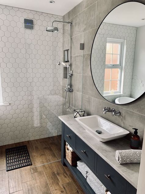 -MEDIUM a moody bathroom with grey tiles, a black vanity, white hex tiles in the shower space looks wow Wood Tile Shower, Wood Effect Floor Tiles, Wet Room Bathroom, Bathroom Cladding, Wood Floor Bathroom, Grey Bathroom Tiles, Wet Room, Bathroom Floor Tiles, Wood Bathroom