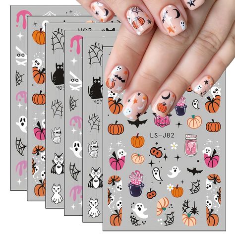 PRICES MAY VARY. 𝐔𝐧𝐢𝐪𝐮𝐞 𝐇𝐚𝐥𝐥𝐨𝐰𝐞𝐞𝐧 𝐃𝐞𝐬𝐢𝐠𝐧𝐬: Each set includes 6 sheets Halloween Nail Stickers featuring an adorable selection of cute and spooky designs, including ghosts, pumpkins, bats, cats, and skulls, perfect for adding a festive touch to your nails. 𝐃𝐮𝐫𝐚𝐛𝐥𝐞 𝐀𝐧𝐝 𝐋𝐨𝐧𝐠-𝐋𝐚𝐬𝐭𝐢𝐧𝐠: Crafted from high-quality materials, these stickers are designed to withstand daily wear, ensuring your Halloween designs remain vibrant throughout the season. 𝐄𝐚𝐬𝐲 𝐭𝐨 ? Cute Ghost Pumpkin, Pumpkin 3d, Monster Nails, Halloween Manicure, Bat Cat, Skull Designs, Pumpkin Nails, Disney Halloween Costumes, Cat Skull