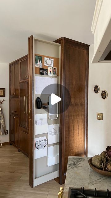 Bre Bertolini on Instagram: "Say hello to our Command Center Closet! When we were designing our kitchen, we had the extra room to put this “broom closet” but we are not broom people 🤷🏻‍♀️ with such a skinny and narrow opening I knew whatever we put here needed to be minimal and fairly flat. So I decided to make a spot for all things organization! Particularly the kids school papers because they seem to multiply overnight 🫠 they used to end up all over our island and now each kid has their own slot to put their stuff and we have a spot for bills, important papers, our family calendar, a cork board and even a place for magnets! and the best part?? It can all get tucked away and out of sight 🙌🏻 what would you use more…a broom closet or a command center closet?!" Broom Cabinet, Modern Vintage Bathroom, Laminate Tile Flooring, Nursery Guest Room, Broom Closet, Laminate Cabinets, Wood Slat Wall, Colored Ceiling, Organization Inspiration