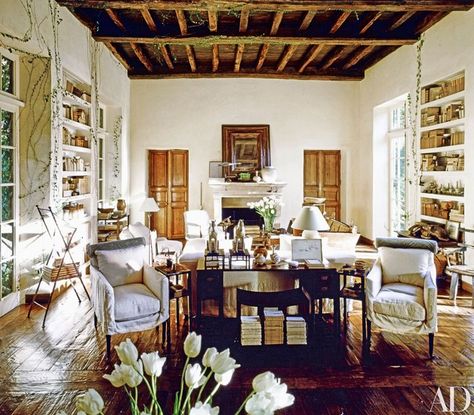 In a June 1991 article on her home in Southern California, Rose Tarlow said, “I was trying to prove to myself that you can create an ageless house.” Decades later, the living room stands the test of time, with its signature design elements, including ceiling crossbeams from an 11th-century English church, 18th-century French doors, and floors of 17th-century oak. Rose Tarlow Interiors, Living Room Stands, Rose Tarlow, Home Design Ideas, French Doors Interior, White Rooms, Interior Barn Doors, Nursing Home, French House