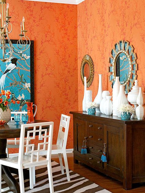 Find your favorite mood with some of these orange color schemes. #colorschemes #orange What Color Goes With Orange, Orange Bedside Table, Orange Dining Room, Taupe Walls, Orange Rooms, Orange Color Schemes, Iron Bed Frame, Living Room Orange, Bedroom Orange