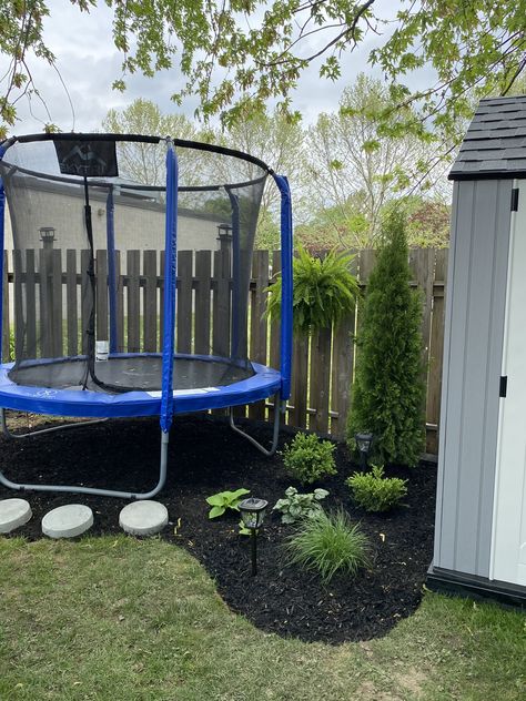 Frustrated that nothing grows under your trampoline, add it into your landscape design. Backyard Pool And Trampoline, Small Backyard Trampoline Ideas, Playset And Trampoline Landscaping, Trampoline In Backyard Ideas, Trampoline Landscaping Ideas, Landscaping Under Trampoline Ideas, Small Backyard With Trampoline, Landscaping Trampoline, Backyard With Trampoline Ideas